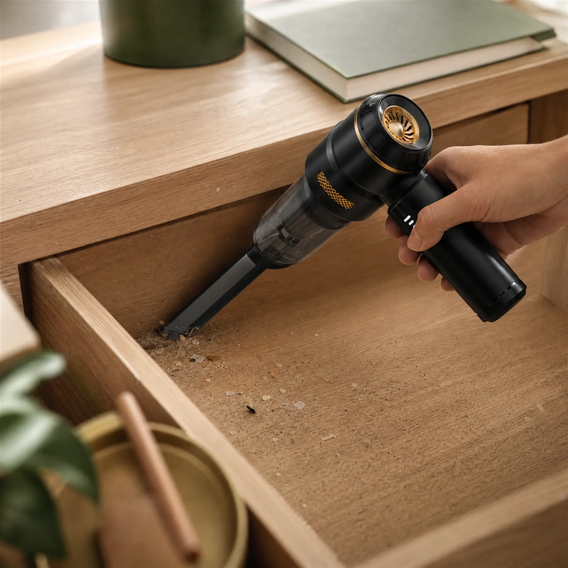 CleanGo cleaning debris from a wooden drawer