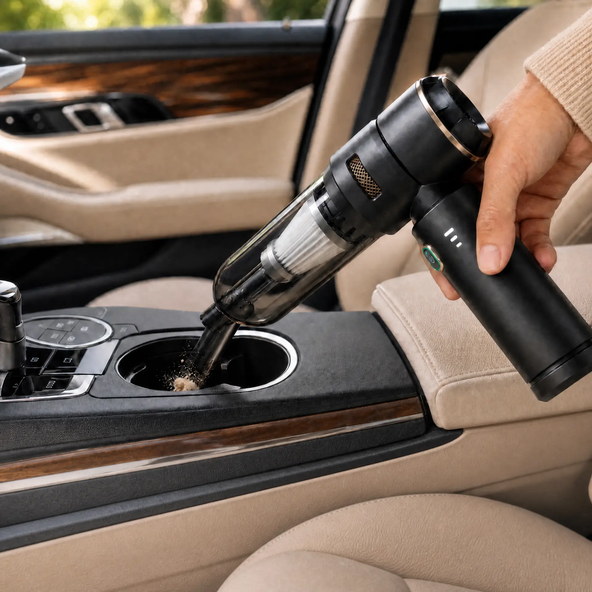 CleanGo vacuuming crumbs from a car cup holder